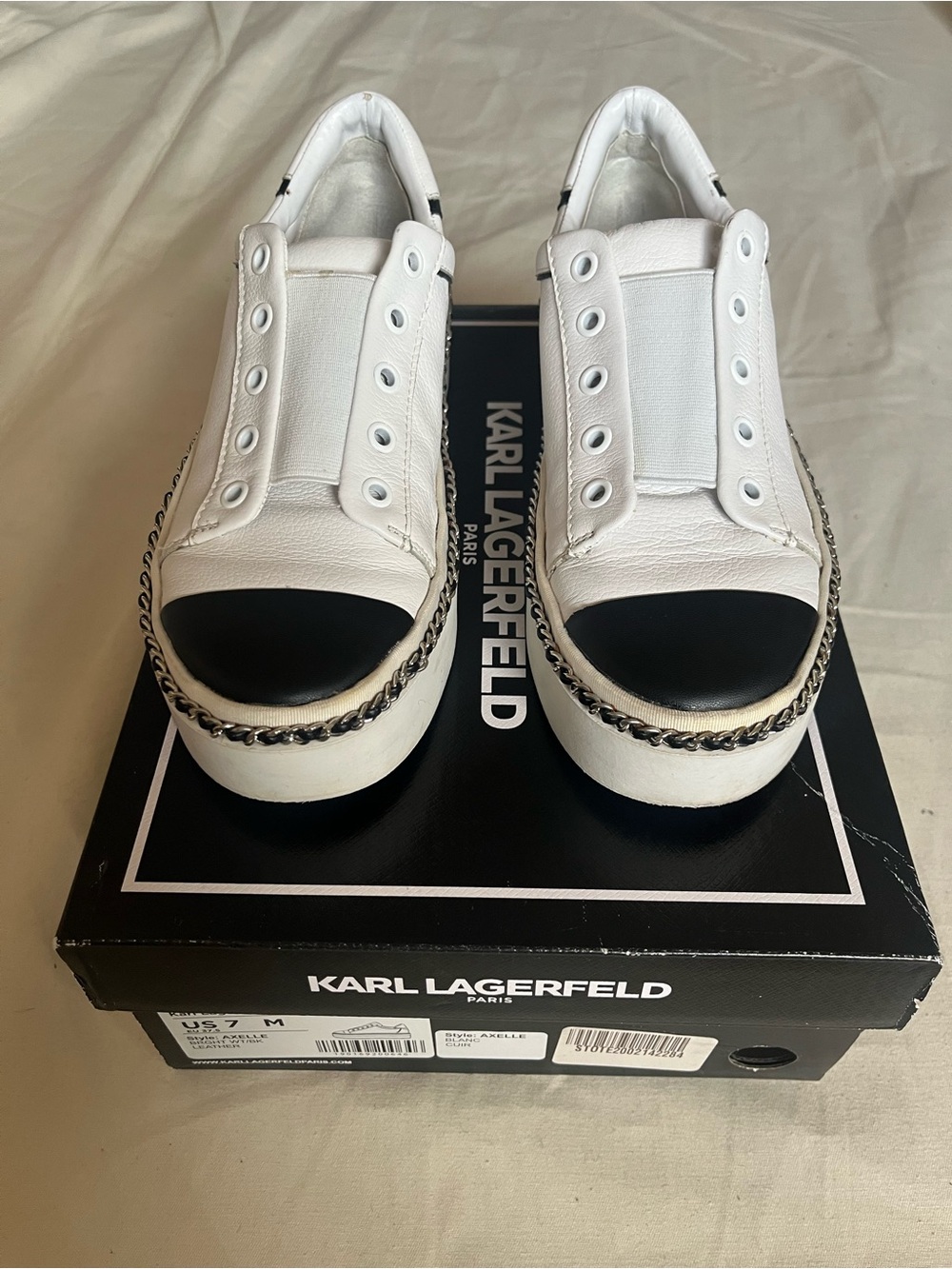 Karl Lagerfeld White Slip-On Platform Sneakers with Black Cap Toe and Chain Trim